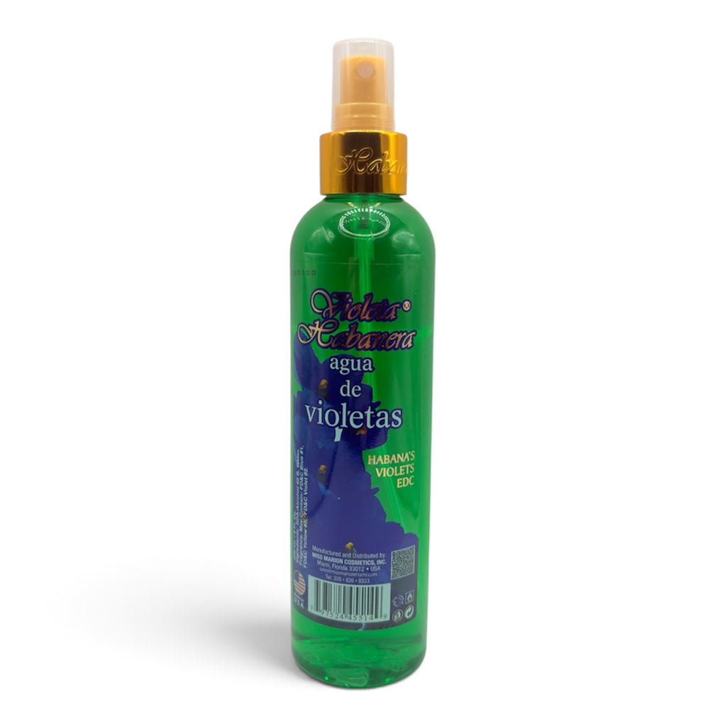 A green plastic spray bottle of 'Relax Relajadora' hair relaxant spray with a gold collar and clear cap, containing a green liquid, on a white background.